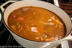 Add Chicken Stock and Water to Cover Short Ribs before placing Dutch Oven in Oven