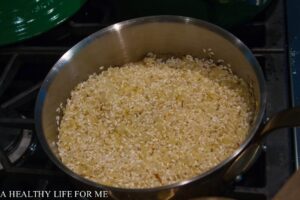 Add Rice to quickly toast with onion