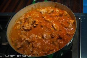 Pureed Tomatoes and Bay Leaves added to Pork and Soffrito
