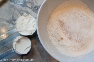 Sour cream and sifted flour, baking powder, baking soda, salt and nutmeg