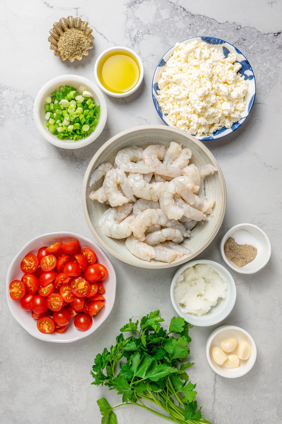 Baked shrimp ingredients measured and arranged on a work surface.