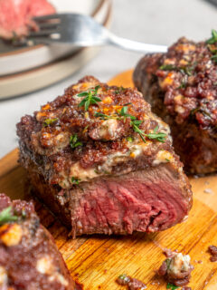 Steak with shallot and blue cheese topping.