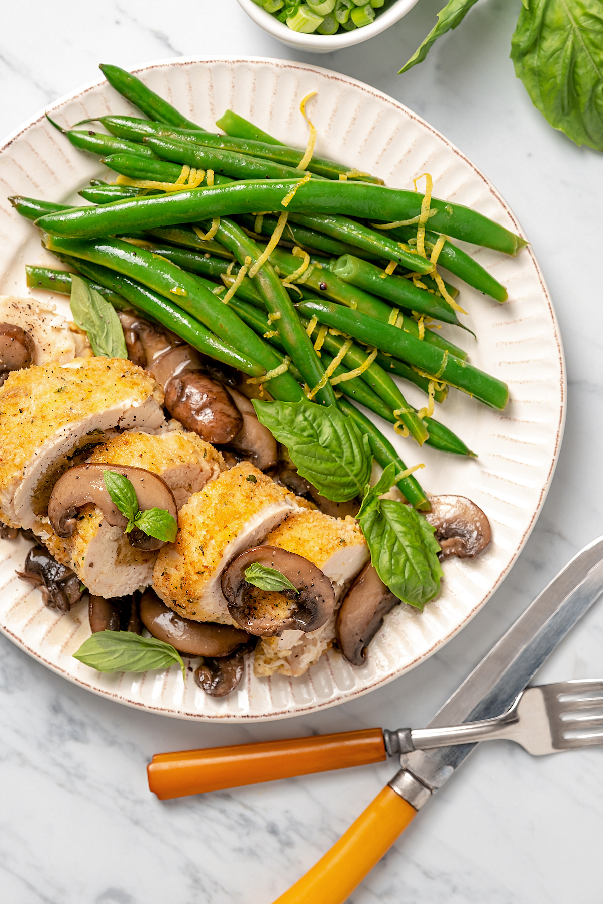 Chicken with mushroom sauce and green beans.