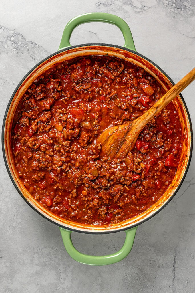 Meat sauce cooking in a skillet.
