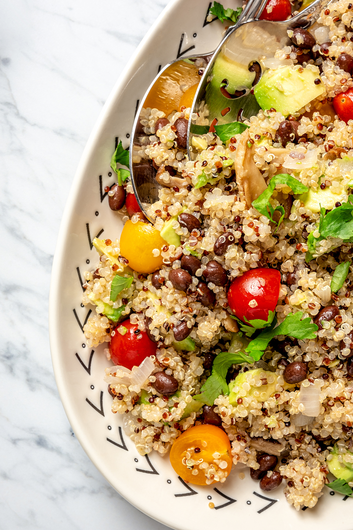 Close-up shot of quinoa salad, showing the texture of the ingredients.