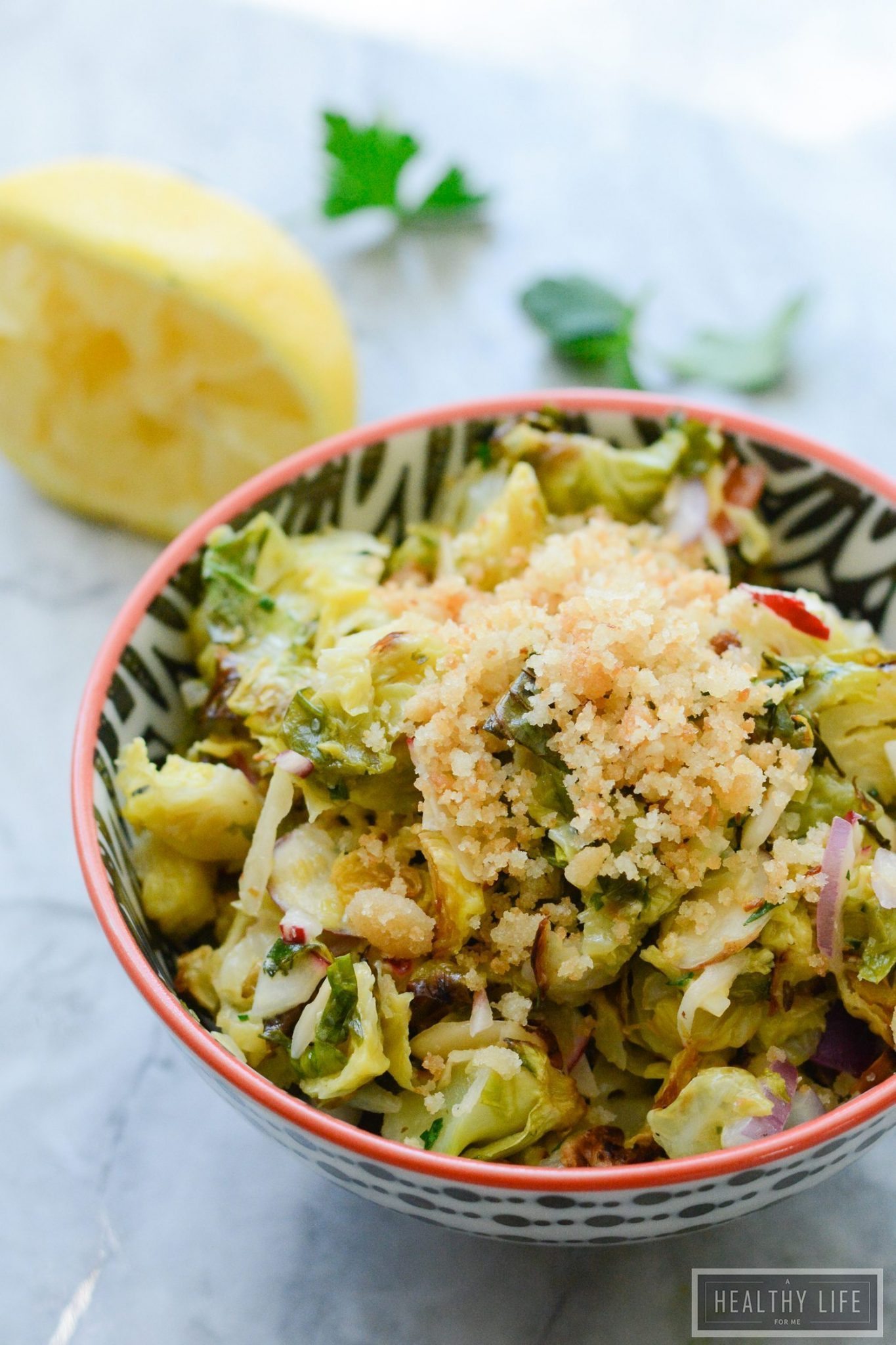 Roasted Brussels Sprouts Slaw is a multi- layered salad that has so much delicious flavor and crunch. A super healthy, gluten free recipe that is loaded with nutritious clean ingredients | ahealthylifeforme.com