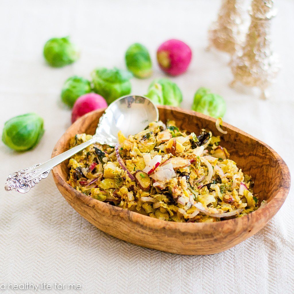 Roasted Brussels Sprout Slaw in a wooden serving bowl.