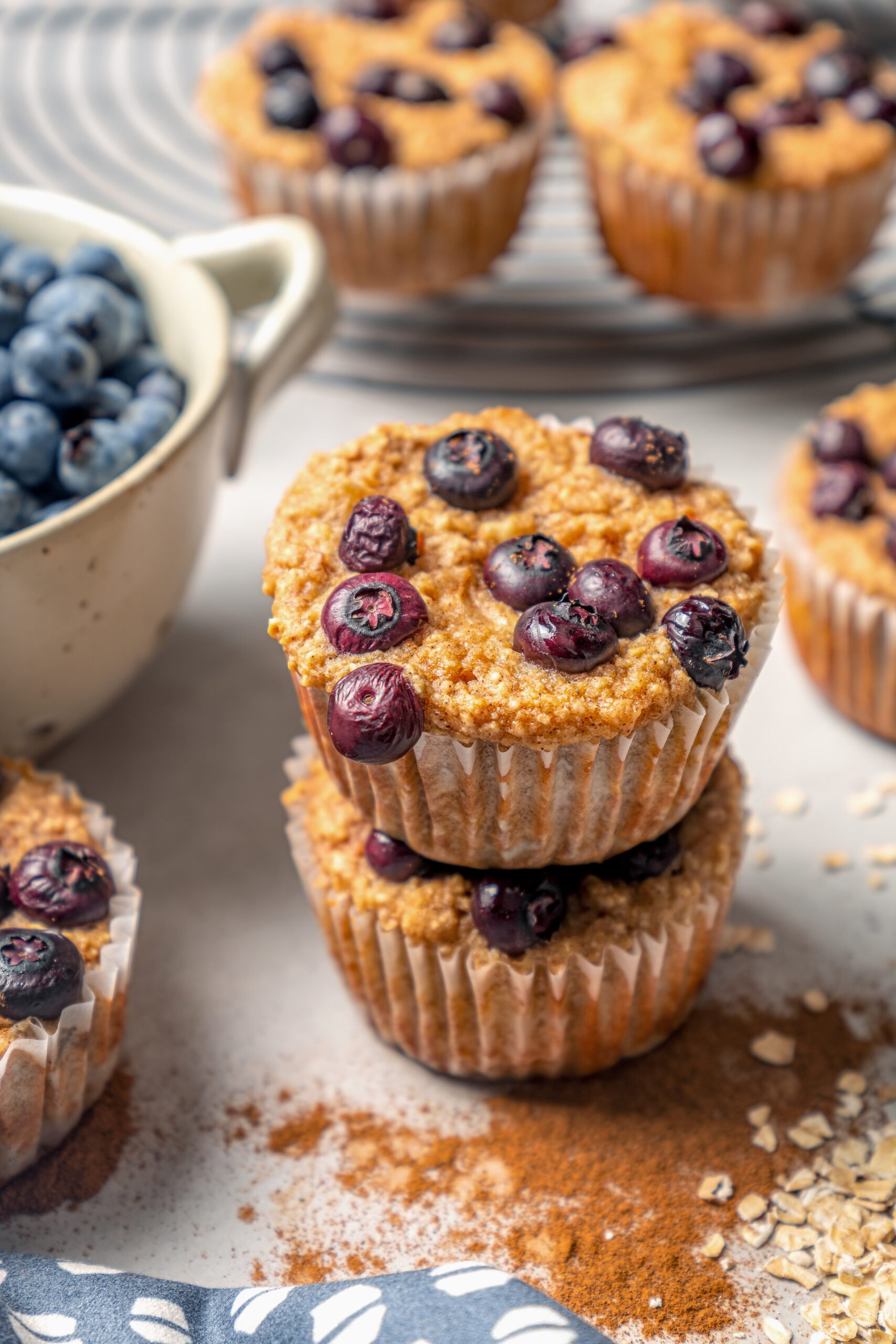 Two stacked blueberry protein muffins. 
