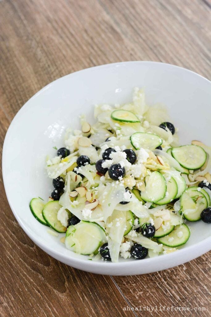 Shaved Fennel Zucchini Salad topped with Blueberries Feta Almonds and Lemon Vinaigrette | ahealthylifeforme.com