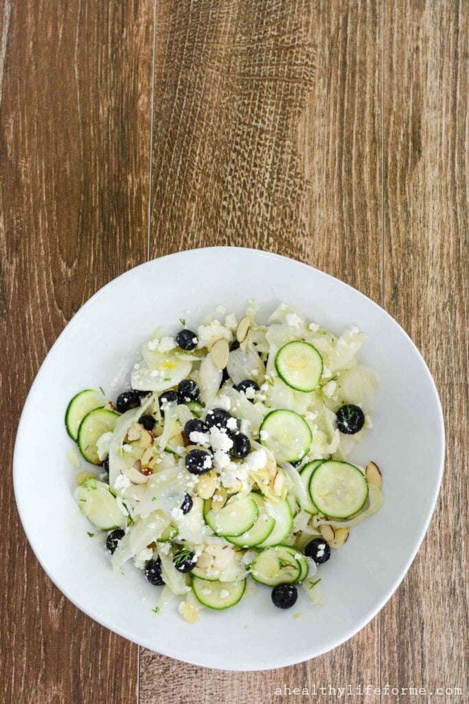 Shaved Fennel Zucchini Salad topped with Blueberries Feta Almonds and Lemon Vinaigrette | ahealthylifeforme.com