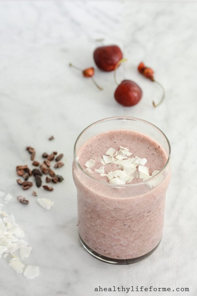 Cherry Coconut Chocolate Smoothie is a sweet healthy decadent smoothie that tastes like a cherry milkshake. Perfect for after your workout or mid day pick me up. It is Gluten Free, Dairy Free, Paleo Frinedly. 