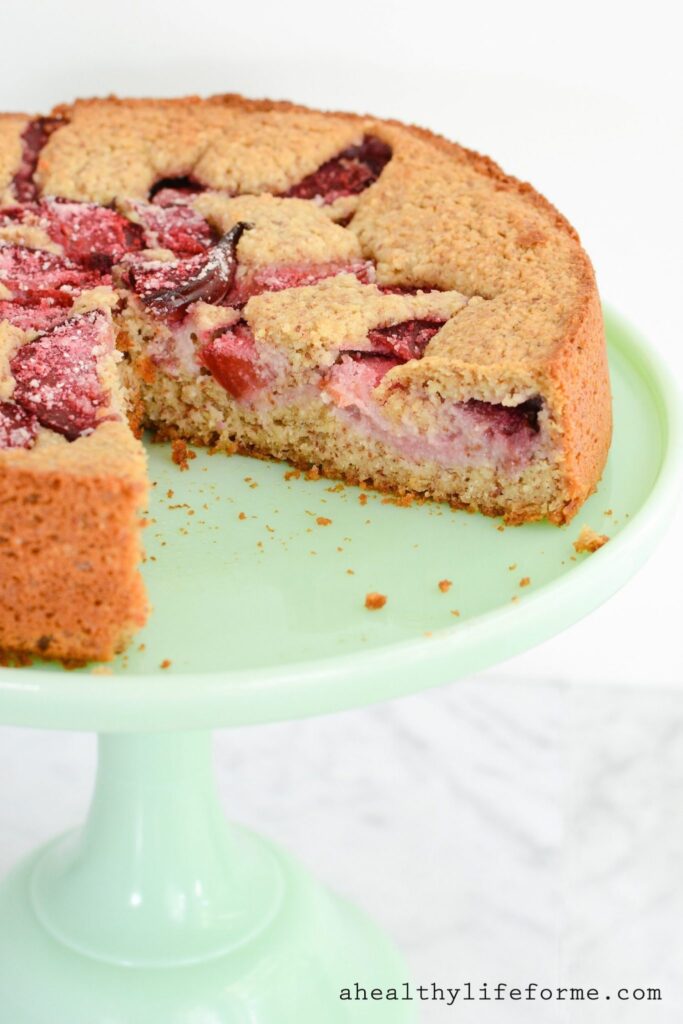 Plum Cake is a moist delicious cake packed full of fresh fruit. Gluten Free, Dairy Free, Paleo Friendly with zero granulated sugar this cake is a great way to enjoy the other summer stone fruit, plums. | ahealthylifeforme.com