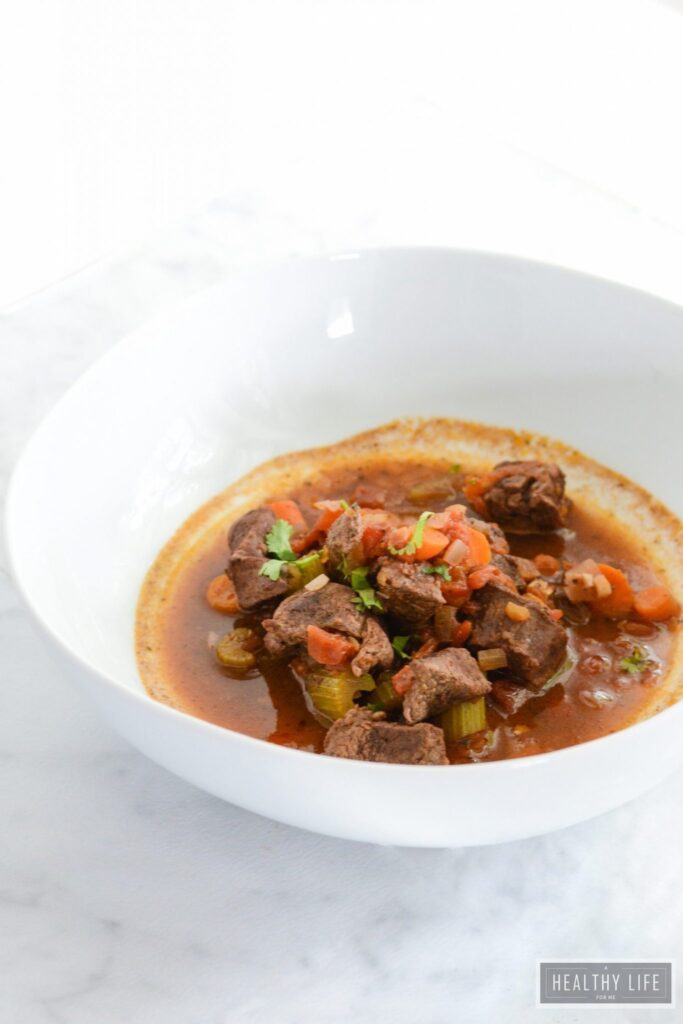 Paleo Lamb Stew is super simple to pull together and loaded with fall spices to give you a zesty, comforting, healthy, clean meal in one pot | ahealthylifeforme.com