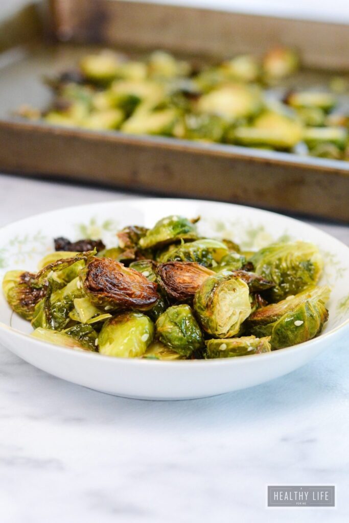 Maple Sesame Roasted Brussels Sprouts are sweet and nutty in flavor. They take minutes to prepare and are ready in less than 30 minutes | ahealthylifeforme.com