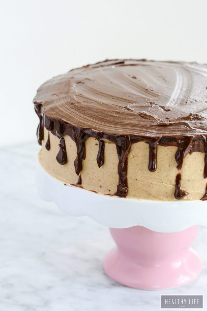 Chocolate Cake with three layers topped with Almond Buttercream Frosting and Chocolate Ganache Gluten Free Recipe | ahealthylifeforme.com