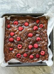 These Gluten Free Double Chocolate Raspberry Brownies are a decadent moist and rich brownie with a little bit of healthy berry goodness rolled up inside and thrown on top | ahealthylifeforme.com