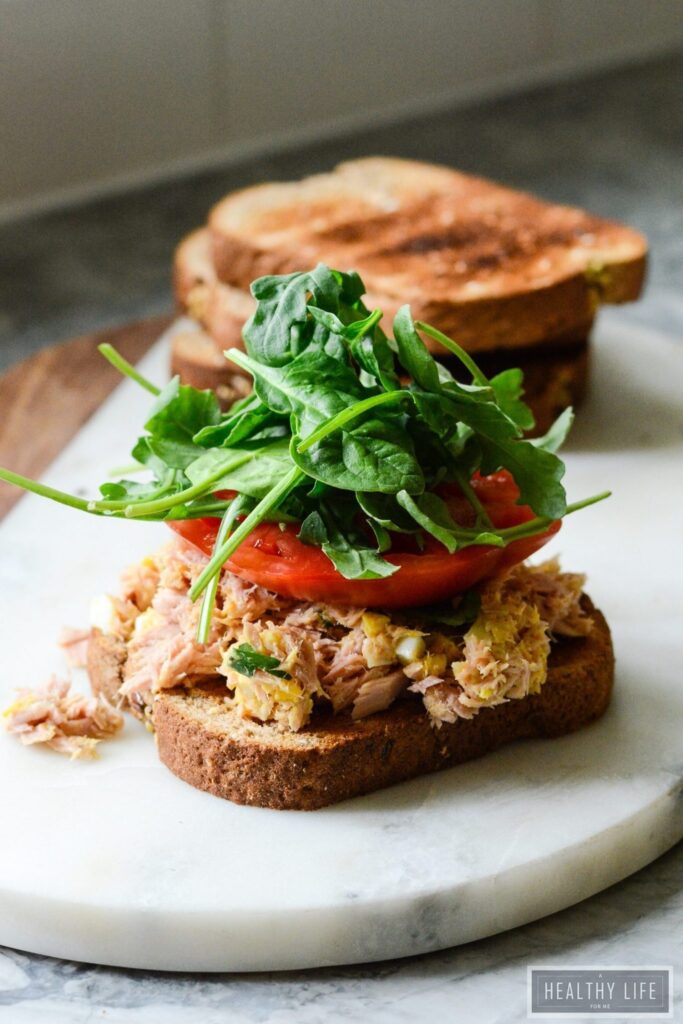 This Yellowfin Tuna Salad Sandwich made with high quality tuna, egg, dijon, a bit of spice all on top of a perfectly toasted piece of bread may be the best tuna salad sandwich ever. High protein, low calorie makes this is the perfect lunch or light dinner recipe | ahealthylifeforme.com
