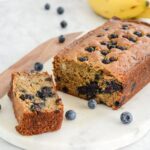 Blueberry banana bread with one slice.