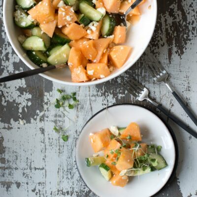 Plate of cantaloupe and cucumber salad.