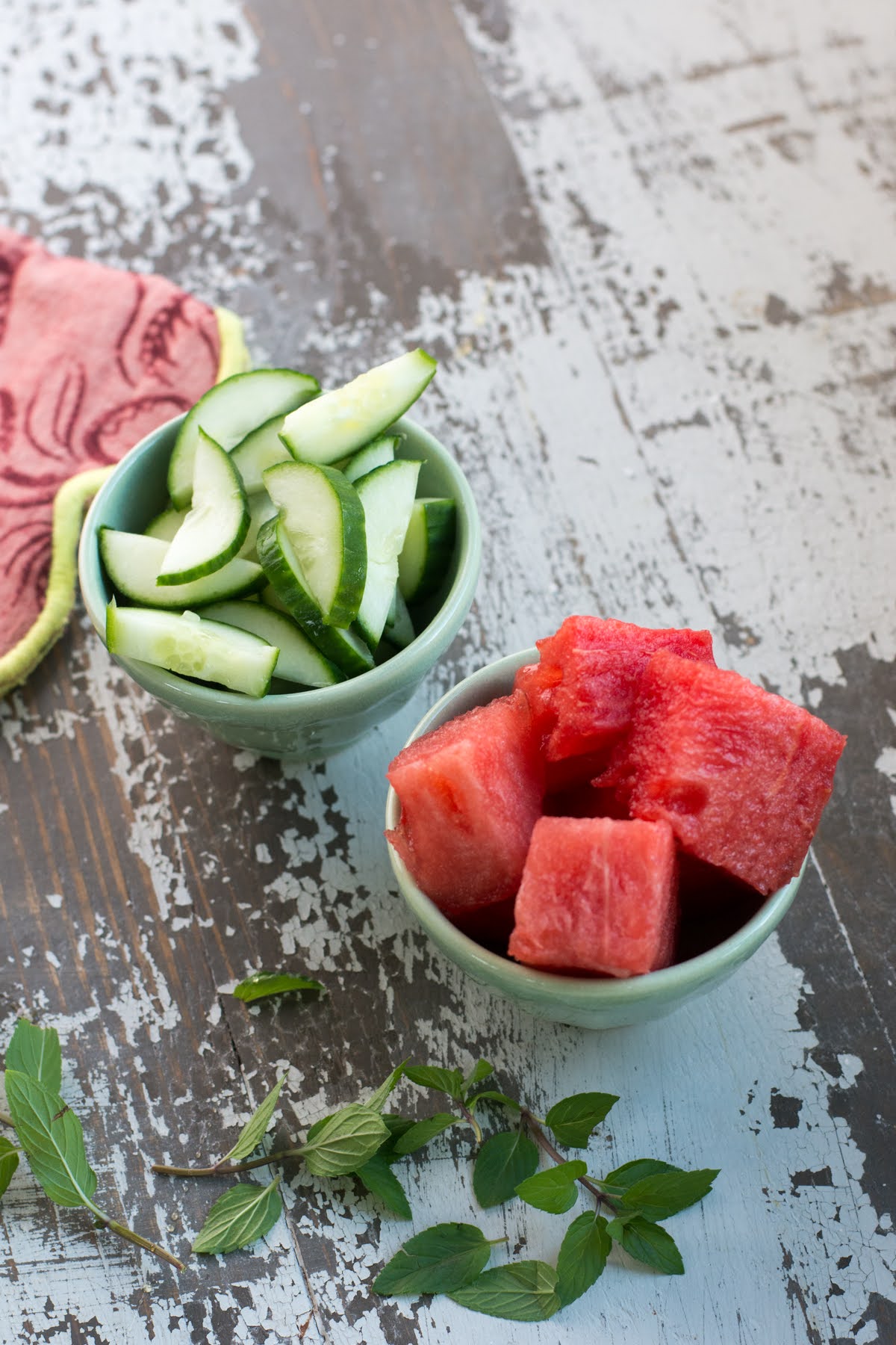 Small bowls of watermelon and cucumber