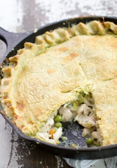 Cooked chicken pot pie with a slice missing