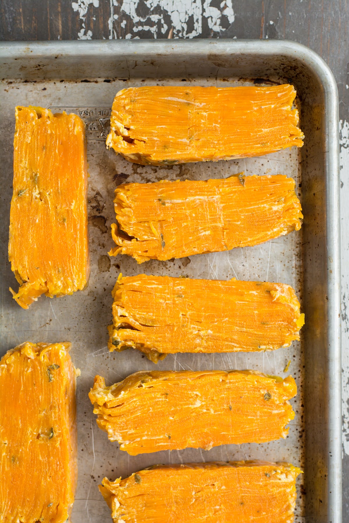 Portions of sweet potato pave on a baking sheet