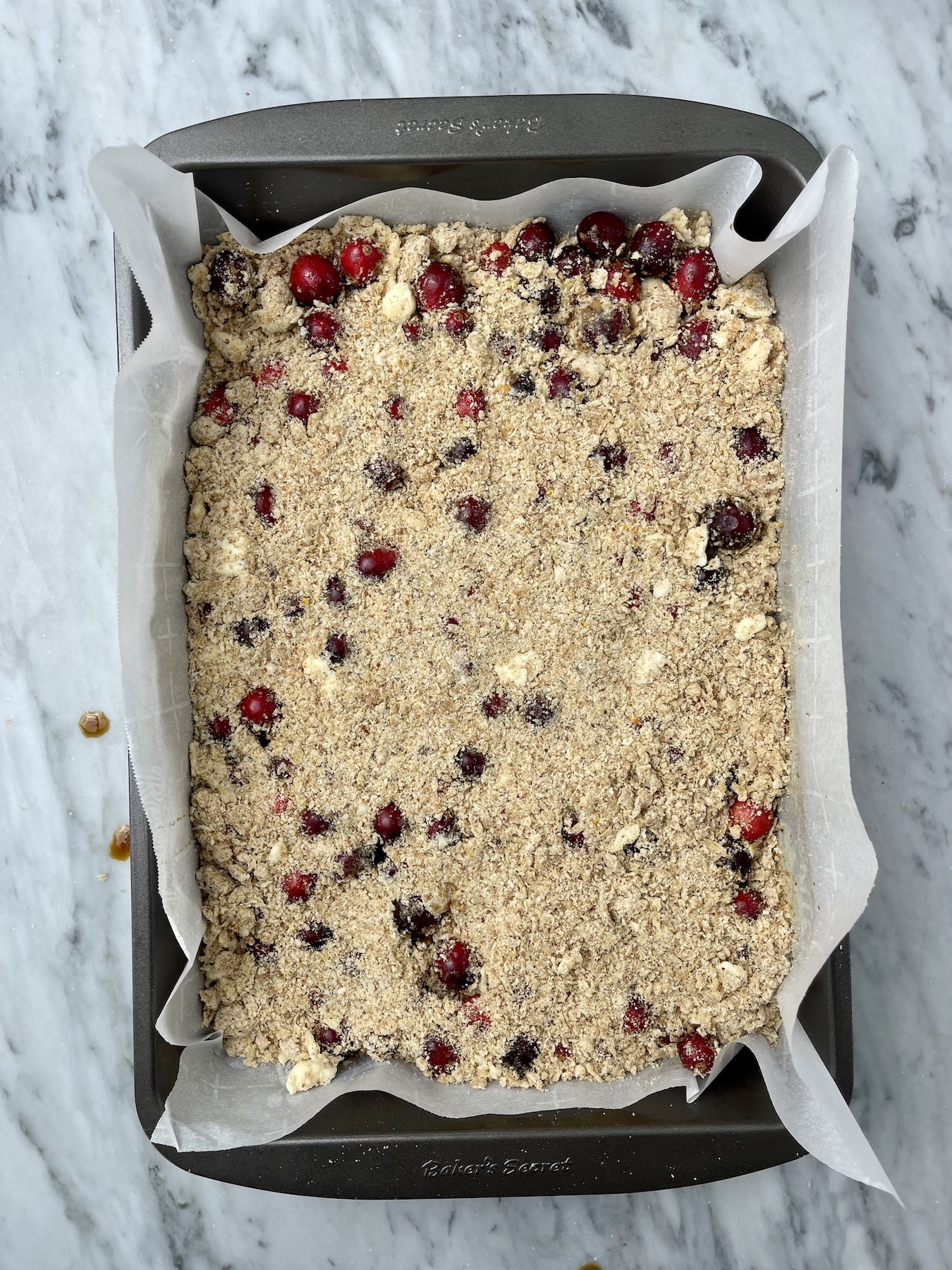 An unbaked cranberry crumble.
