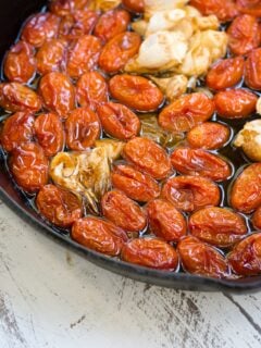Roasted tomatoes in oil with garlic and shallot.