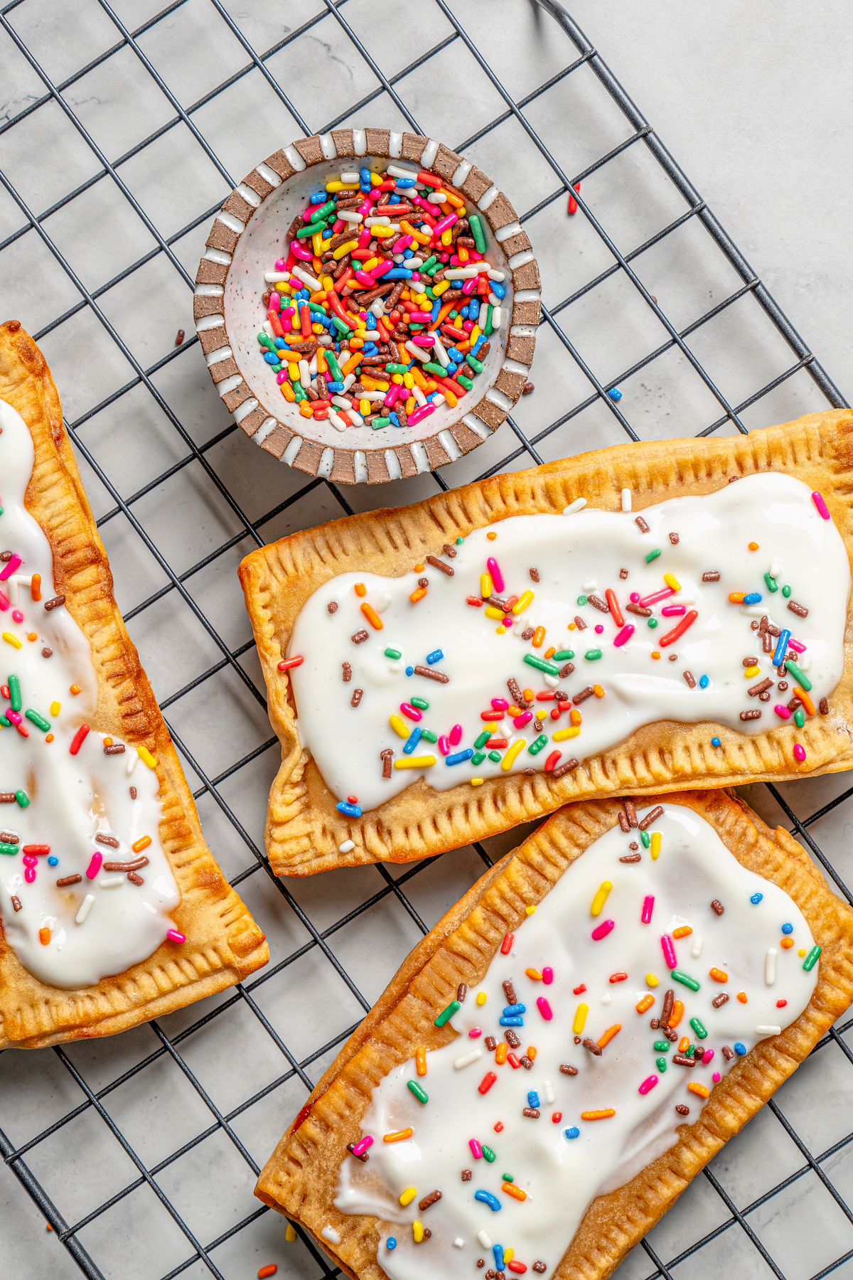 Pop tarts and a bowl of sprinkles on the side. 