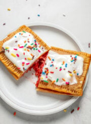 Protein pop tarts with frosting cut in half.