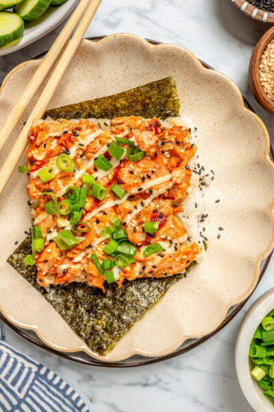 Salmon sushi bake with green onions and nori.