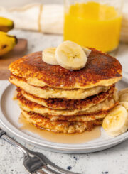 Vanilla protein pancakes with slices of banana on top.