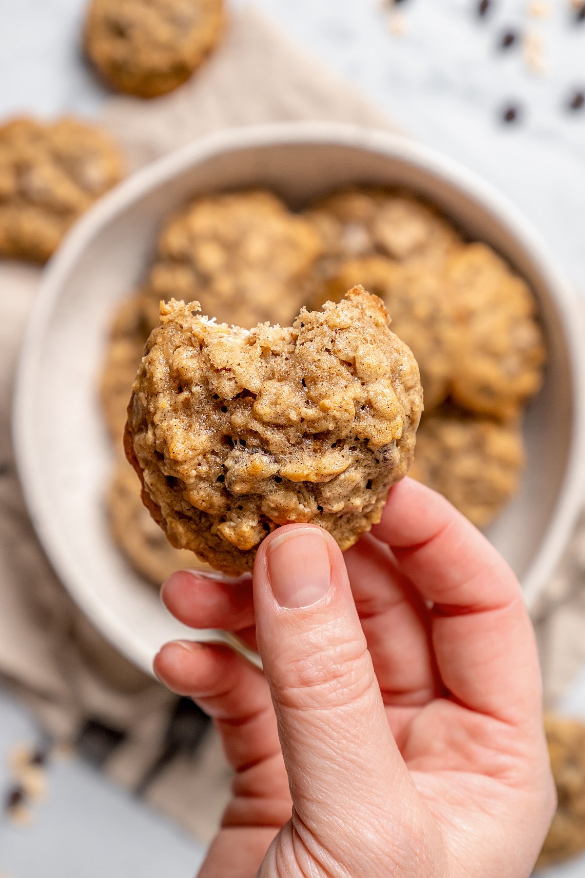 Close-up of a bitten oatmeal chocolate chip cookies.